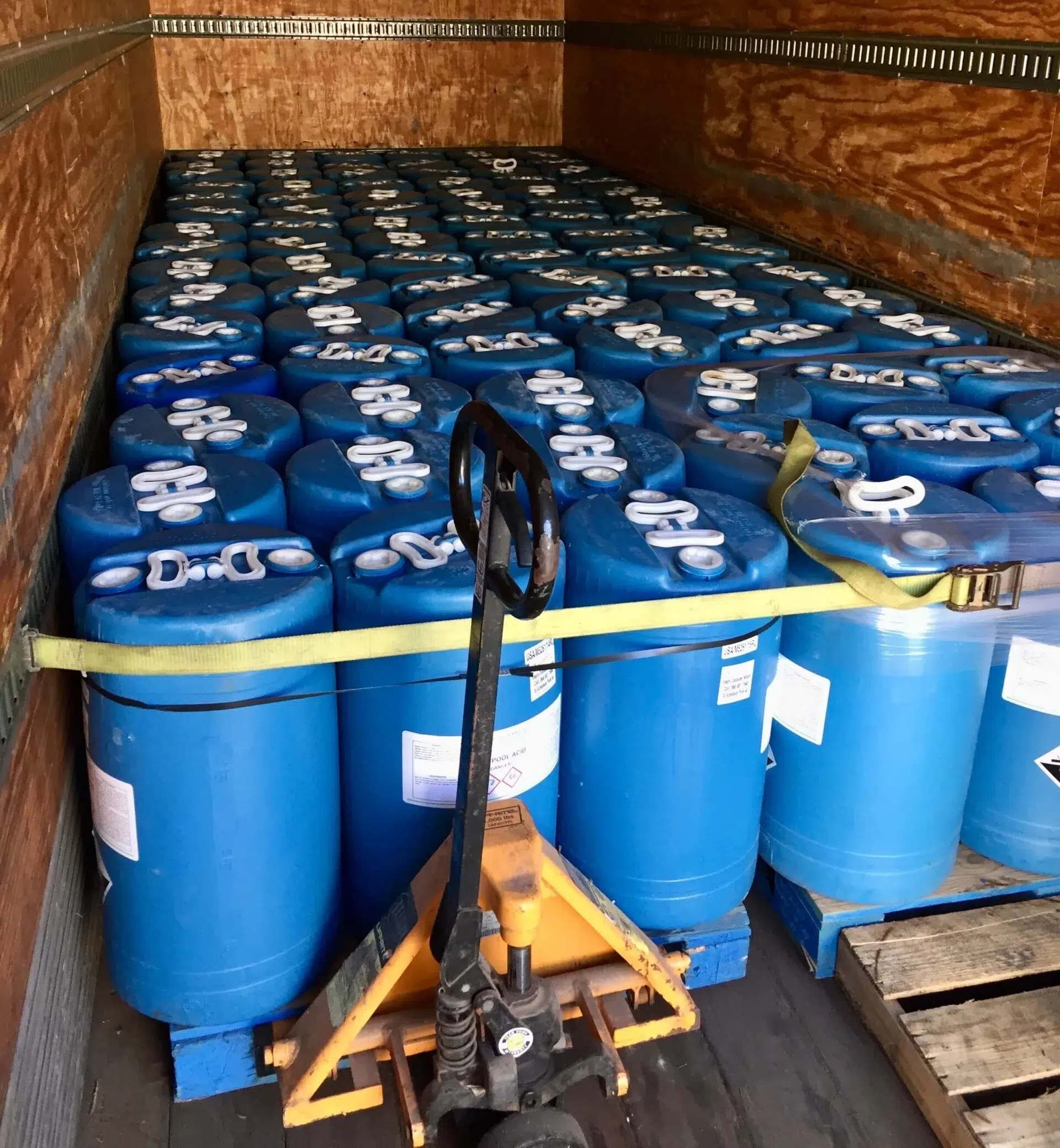 Mobile solvent and supply truck showing drums used for industrial chemical distribution